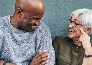 Man and woman socially engaged in friendly conversation.